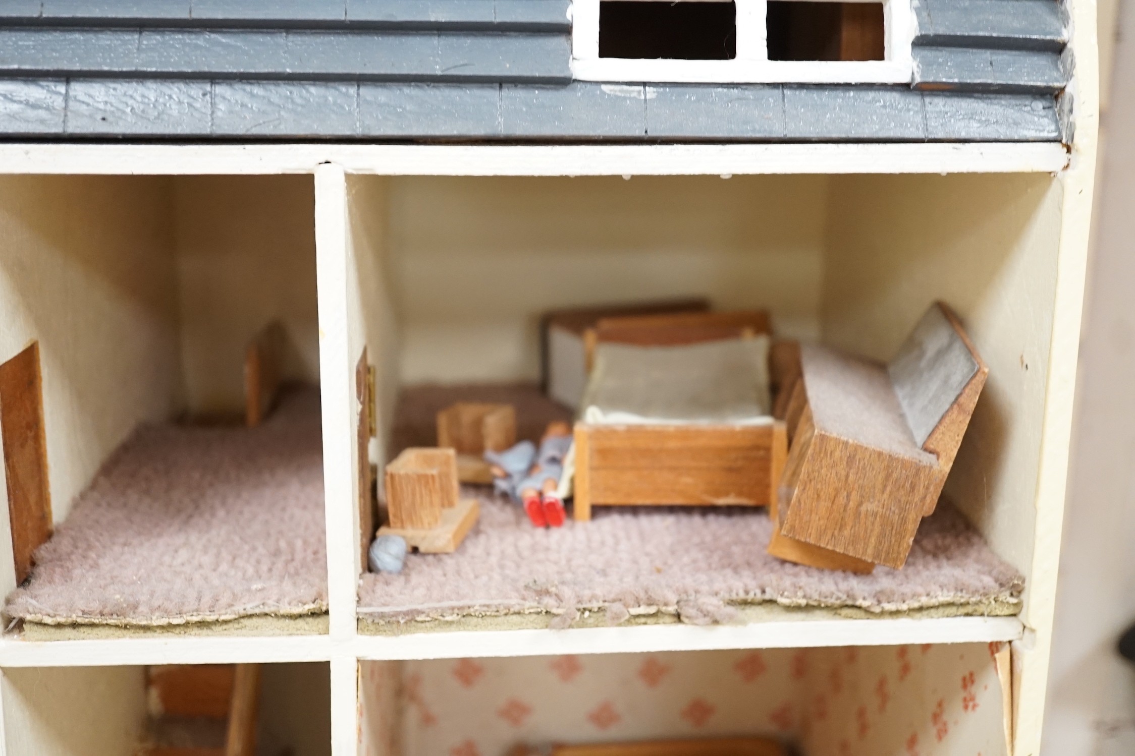 A doll's house based on a Georgian Bath townhouse, with contents, 43cm wide, 71cm high